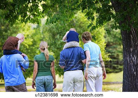 Stock Photo - Family walking together. Fotosearch