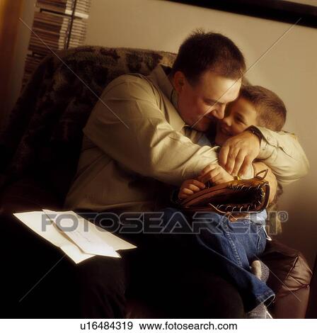Father hugging son View Large Photo Image Stock Photo - Father hugging son. Fotosearch