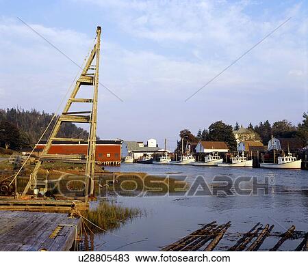 Stock Image - Fishing boats at harbour. Fotosearch