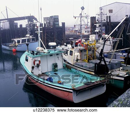 Stock Photography - Fishing boats in a harbour. Fotosearch