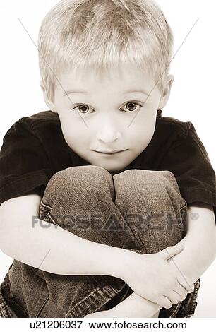 Stock Photo - Front view of a boy looking at camera. Fotosearch