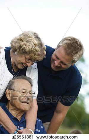 Stock Image - Front view of a happy family. Fotosearch