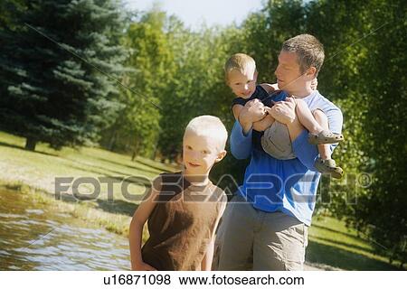 Front view of father playing with children View Large Photo Image Stock Photo - Front view of father playing with children. Fotosearch