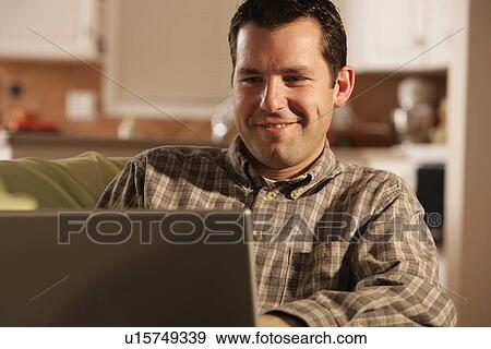 Front view of man smiling View Large Photo Image Stock Photo - Front view of man smiling. Fotosearch