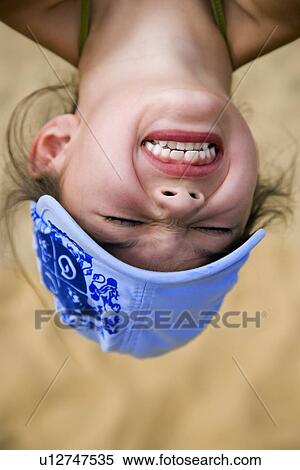 Girl hanging upside down View Large Photo Image Stock Photography - Girl hanging upside down . Fotosearch