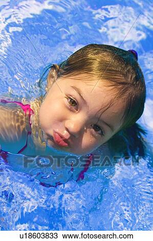 Girl in swimming pool View Large Photo Image Stock Image - Girl in swimming pool . Fotosearch