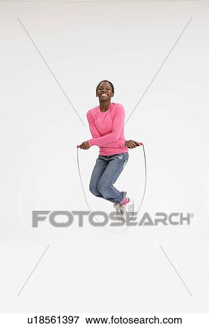 Girl using a skipping rope View Large Photo Image Stock Photo - Girl using a skipping rope. Fotosearch