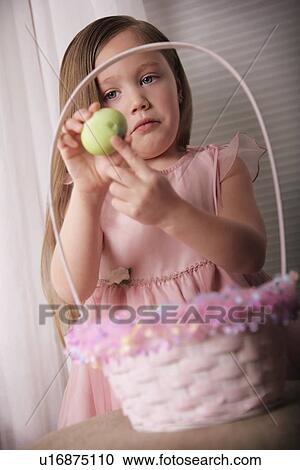 Girl with cracked Easter Egg View Large Photo Image Stock Image - Girl with cracked Easter Egg. Fotosearch
