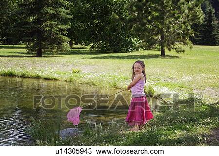 Girl with fishing net View Large Photo Image Stock Image - Girl with fishing net. Fotosearch