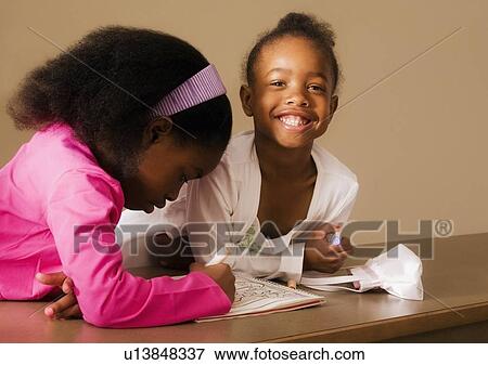Stock Photo - Girls playing together. Fotosearch