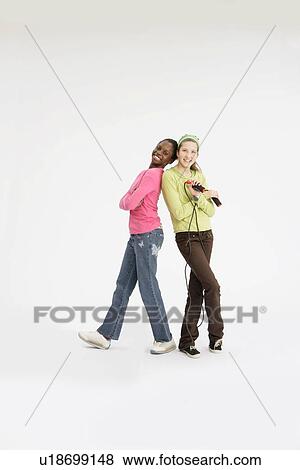 Stock Photo - Girls standing with skipping rope. Fotosearch