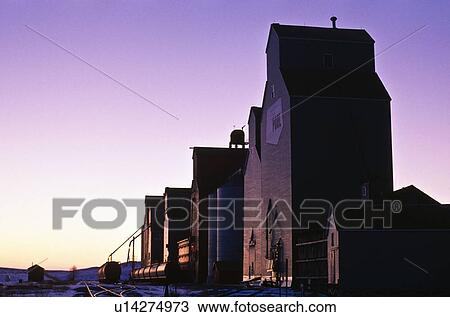 Stock Image - Graineries at sunset. Fotosearch
