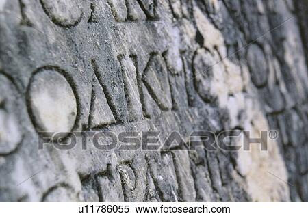Stock Photography - Greece, Olympia, Ancient writing on stone. Fotosearch