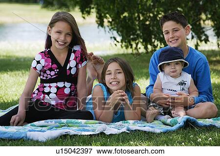 Group of kids sitting together View Large Photo Image Stock Photo - Group of kids sitting together. Fotosearch