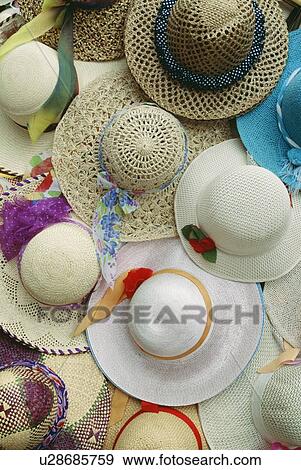 Stock Photo - Hats for sale at a market. Fotosearch