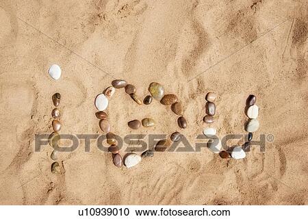 I love you written as 'i heart u' in stones on the sand View Large Photo Image Stock Image - I love you written as 'i heart u' in stones on the sand. Fotosearch