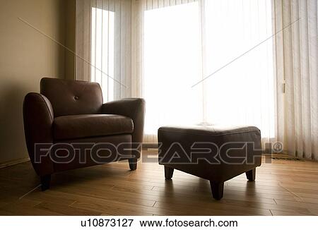Living room with armchair and ottoman View Large Photo Image Stock Photo - Living room with armchair and ottoman. Fotosearch