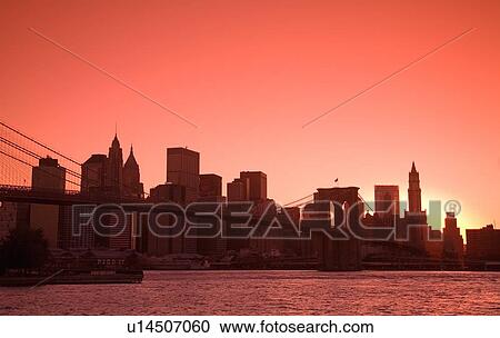 Stock Image - Lower Manhattan Skyline viewed from Brooklyn Bridge Park, Brooklyn, New York City, New York, USA . Fotosearch