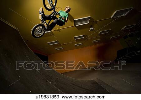 Man doing bicycle stunt View Large Photo Image Stock Photo - Man doing bicycle stunt. Fotosearch