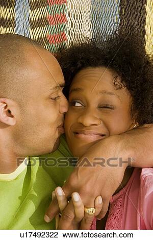 Man hugging and kissing woman View Large Photo Image Stock Image - Man hugging and kissing woman. Fotosearch