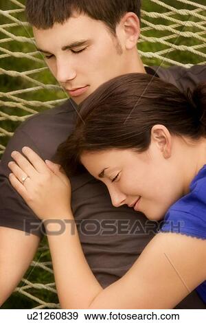 Married couple relaxing together View Large Photo Image Stock Photo - Married couple relaxing together. Fotosearch