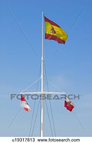 Mast bearing the Spanish national flag and two Cantabrian provincial flags View Large Photo Image Stock Image - Mast bearing the Spanish national flag and two Cantabrian provincial flags . Fotosearch