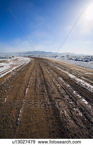 Melting snow on dirt road View Large Photo Image Stock Photo - Melting snow on dirt road. Fotosearch