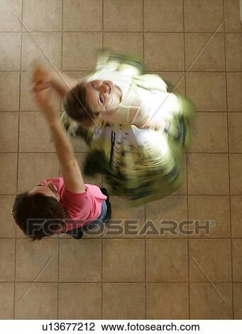 Mother and daughter dancing View Large Photo Image Stock Image - Mother and daughter dancing. Fotosearch