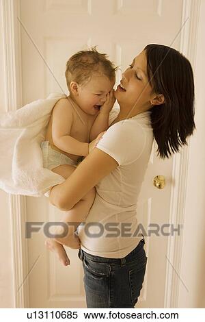 Mother holding boy View Large Photo Image Stock Photography - Mother holding boy. Fotosearch