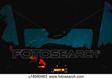 Night star trails through window of a vehicle View Large Photo Image Stock Image - Night star trails through window of a vehicle . Fotosearch