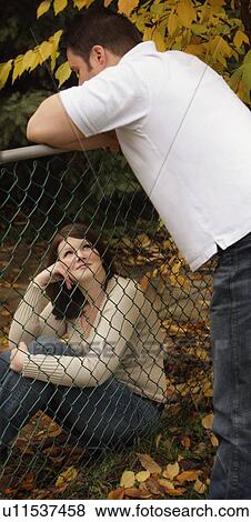 On the opposite sides of the fence View Large Photo Image Stock Photo - On the opposite sides of the fence. Fotosearch
