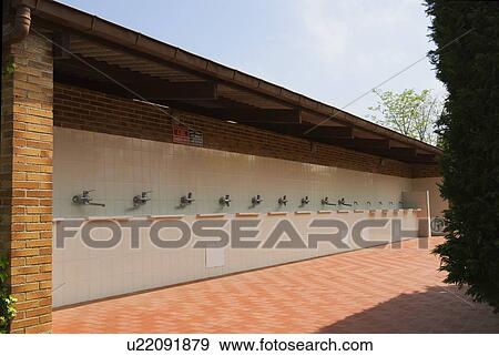 Outdoor washing facilities at a trailer park View Large Photo Image Stock Photo - Outdoor washing facilities at a trailer park. Fotosearch