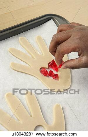 Stock Photo - Overhead view of a person garnishing food. Fotosearch