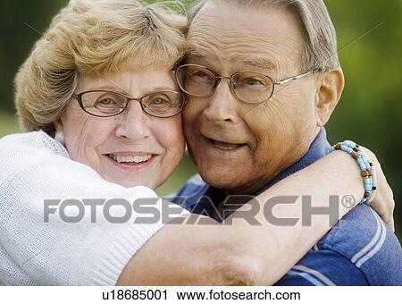 Stock Image - Portrait of senior couple hugging. Fotosearch