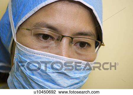 Portrait of surgeon wearing mask View Large Photo Image Stock Image - Portrait of surgeon wearing mask. Fotosearch