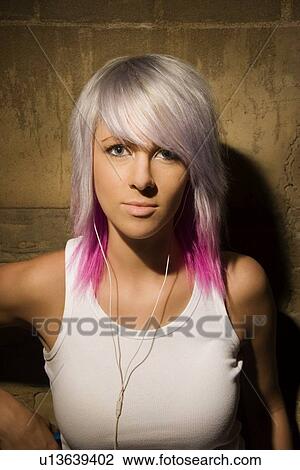 Portrait of woman with ear buds in ears View Large Photo Image Stock Image - Portrait of woman with ear buds in ears. Fotosearch