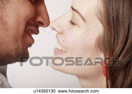 Profile of a couple about to kiss View Large Photo Image Stock Image - Profile of a couple about to kiss. Fotosearch