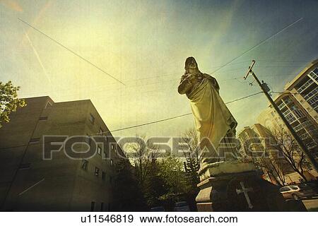 Stock Photo - Religious statue in the city. Fotosearch