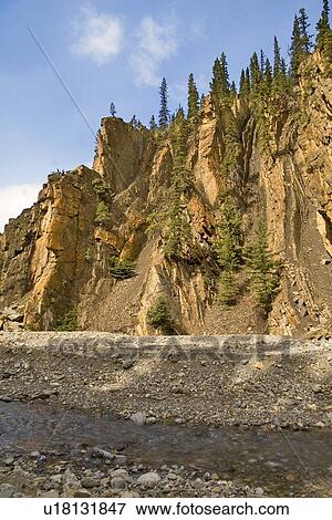 Stock Photo - Rock formations above Allstones Creek, Alberta, Canada . Fotosearch