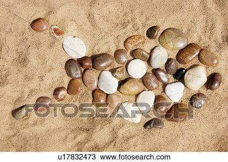 Stock Image - Rocks in the shape of a fish. Fotosearch