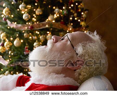 Stock Photo - Santa taking a nap. Fotosearch