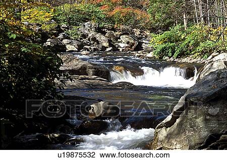 Stock Image - Scenery surrounding waterfall. Fotosearch