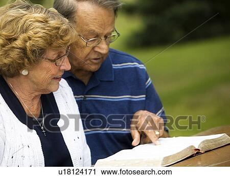 Senior couple reading the Bible View Large Photo Image Stock Image - Senior couple reading the Bible. Fotosearch
