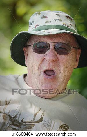 Picture - Senior man making a silly face. Fotosearch