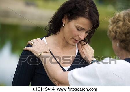 Senior woman consoling her daughter View Large Photo Image Picture - Senior woman consoling her daughter. Fotosearch
