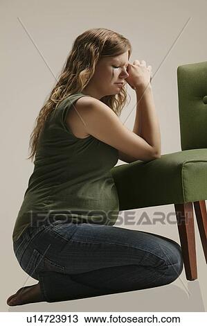 Side view of a pensive pregnant woman sitting by chair View Large Photo Image Stock Image - Side view of a pensive pregnant woman sitting by chair. Fotosearch