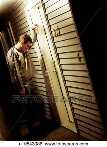 Stock Photograph - Side view of a sad man. Fotosearch
