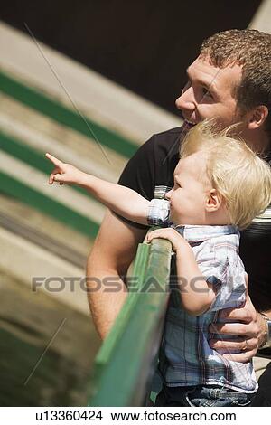 Side view of father with son View Large Photo Image Picture - Side view of father with son. Fotosearch
