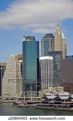Stock Image - South Street Seaport Museum and Lower Manhattan Skyline, New York City, New York, USA . Fotosearch