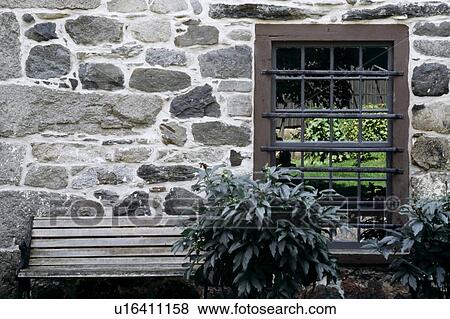Stone building with bench and window View Large Photo Image Stock Photo - Stone building with bench and window. Fotosearch